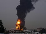 Fire and plumes of smoke rises after a drone struck a fuel tank forcing the temporary suspension of flights. near Dubai International Airport, in United Arab Emirates, on March 16 (AP) Fire and plumes of smoke rises after a drone struck a fuel tank forcing the temporary suspension of flights. near Dubai International Airport, in United Arab Emirates, on March 16 (AP)
