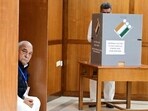 Haryana Congress Legislature Party (CLP) leader and former chief minister Bhupinder Singh Hooda looking on as Panchkula MLA and ex-deputy CM Chander Mohan casts his vote for the Rajya Sabha election in Chandigarh on Monday. (Keshav Singh/HT)