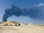 Dubai Abu Dhabi news LIVE: Smoke rises in the Fujairah oil industry zone, caused by debris after interception of a drone by air defenses amid the US-Israel conflict with Iran, in Fujairah, United Arab Emirates.