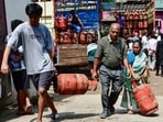 People carry LPG cylinder amid the reports of nationwide shortage of LPG gas cylinders, in Guwahati on Monday. (ANI) People carry LPG cylinder amid the reports of nationwide shortage of LPG gas cylinders, in Guwahati on Monday. (ANI)
