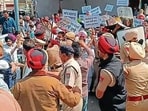Police apprehended Congress workers in Khanna in Ludhiana on Monday. (HT Photo) Police apprehended Congress workers in Khanna in Ludhiana on Monday. (HT Photo)