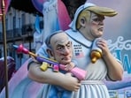 Gigantic cardboard structures, or 'ninots', depicting Donald Trump holding Benjamin Netanyahu as displayed during the Fallas festival in Valencia on March 16, 2026.