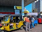 An employee fills petrol in an autorickshaw at a filling station in Wellawatte on the outskirts of Colombo. An employee fills petrol in an autorickshaw at a filling station in Wellawatte on the outskirts of Colombo.