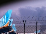 Smoke in the background after a drone struck a fuel tank at the Dubai International Airport. (AP)