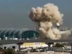 Smoke rising from the Dubai International Airport. Dubai airport, the world's busiest for international traffic, after a drone attack by Iran.
