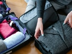 Neatly arranged packing cubes inside an open suitcase, showing tidy clothing sections ready for a smooth holiday packing routine today.(Pexels)