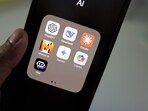 The Claude logo is seen at the right here on the phone screen in this representative image. The Claude logo is seen at the right here on the phone screen in this representative image.