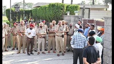 GLADA officials with police force to inspect the house and other construction that has been done without permission . (HT Photo) GLADA officials with police force to inspect the house and other construction that has been done without permission . (HT Photo)