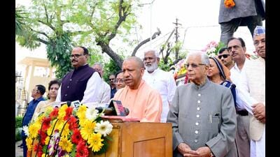 UP CM Yogi Adityanath, dy CM Brajesh Pathak and others paying tribute to HN Bahuguna on his death anniversary. (HT photo)