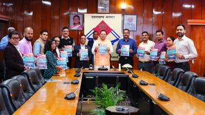 CM Pushkar Singh Dhami releases the Uttarakhand Secretariat Badminton Club souvenir “Prayas Behtar Kal Ke Liye” in Dehradun on Tuesday.