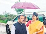 A photo showing Rupali Chakankar, chairperson of the state women’s commission, holding an umbrella for Ashok Kharat was shared widely on social media (Anjali Damania/X)