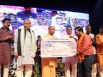 Chief minister Yogi Adityanath at the gathering at Lok Bhavan, where he distributed financial assistance of  <span class='webrupee'>₹</span>1 lakh each to 555 pilgrims of Kailash Mansarovar Yatra. (Sourced)