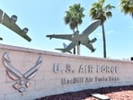 A sign for MacDill Air Force Base is displayed on a concrete wall near the main gate along South Dale Mabry Highway in Tampa, Florida, U.S. March 18, 2026.  REUTERS/Octavio Jones
