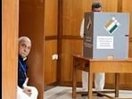 Haryana Congress Legislature Party (CLP) leader and former chief minister Bhupinder Singh Hooda looking on as Panchkula MLA and ex-deputy CM Chander Mohan casts his vote for the Rajya Sabha election in Chandigarh on Monday. (Keshav Singh/HT)