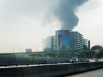 Smoke rising from an area near the Dubai International Airport after a drone attack hit a fuel tank, amid the U.S.-Israel conflict with Iran. 
