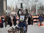 Jessie Holmes celebrates his Iditarod success as his journey from reality TV to champion draws attention.