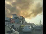 Plumes of smoke emanating from the fire in a building in Palam, Delhi, on Wednesday. (Sylvester Tamang/ HT Photo)