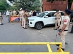 Police personnel keep vigil near the crime spot at Panjab University in Chandigarh on Tuesday. (Ravi Kumar/HT)