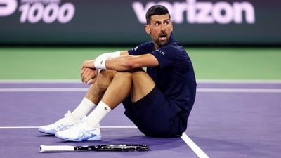 Novak Djokovic sits up after falling to the court with exhaustion against Jack Draper in their fourth round match at Indian Wells Tennis Garden on March 11 (Getty Images via AFP) Novak Djokovic sits up after falling to the court with exhaustion against Jack Draper in their fourth round match at Indian Wells Tennis Garden on March 11 (Getty Images via AFP)