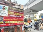 Posters of an outrage march near Hastsal village, Uttam Nagar, on Wednesday. Sanchit Khanna/HT photo