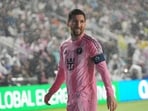 Inter Miami forward Lionel Messi walks to kick a corner kick in heavy rain during the first half of a CONCACAF Champions Cup Round of 16 match vs Nashville