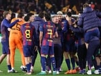 Barcelona's German coach Hans-Dieter Flick and players celebrate after the Champions League last 16 second leg match win vs Newcastle United