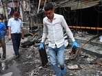 FSL team investigates the site of the fire. (Vipin Kumar/HT Photo)