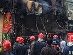 Firefighters attempt to douse a massive fire that gutted a building in Sadh Nagar near Palam in New Delhi on Wednesday. (Vipin Kumar /HT PHOTO)