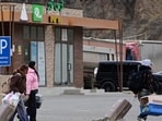 Iranian refugees walk with their belongings after crossing the border from Iran to Armenia at a border check point in the southern Armenian town of Meghri, on March 8 (AFP FILE) Iranian refugees walk with their belongings after crossing the border from Iran to Armenia at a border check point in the southern Armenian town of Meghri, on March 8 (AFP FILE)