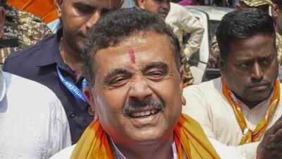 BJP workers celebrated Adhikari’s arrival with drumbeats, posters and party flags. (PTI photo) BJP workers celebrated Adhikari’s arrival with drumbeats, posters and party flags. (PTI photo)