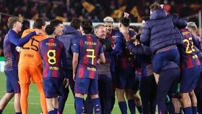 Barcelona's German coach Hans-Dieter Flick and players celebrate after the Champions League last 16 second leg match win vs Newcastle United (AFP) Barcelona's German coach Hans-Dieter Flick and players celebrate after the Champions League last 16 second leg match win vs Newcastle United (AFP)