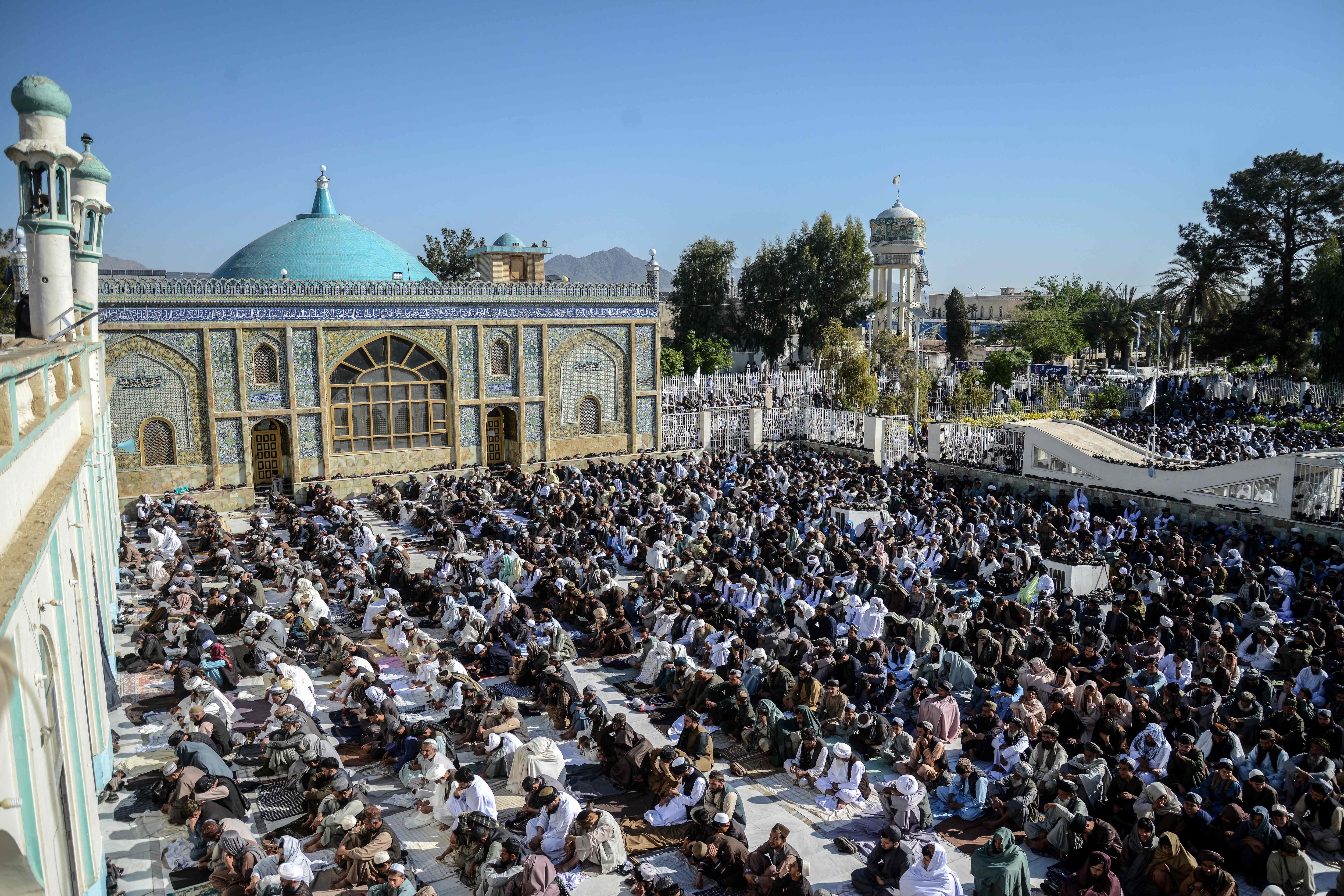 Afghan Muslims gather to offer Eid al-Fitr prayers, which marks the end of the holy fasting month of Ramadan at the Kharqa Sharif mosque in Kandahar on March 19, 2026. (AFP)