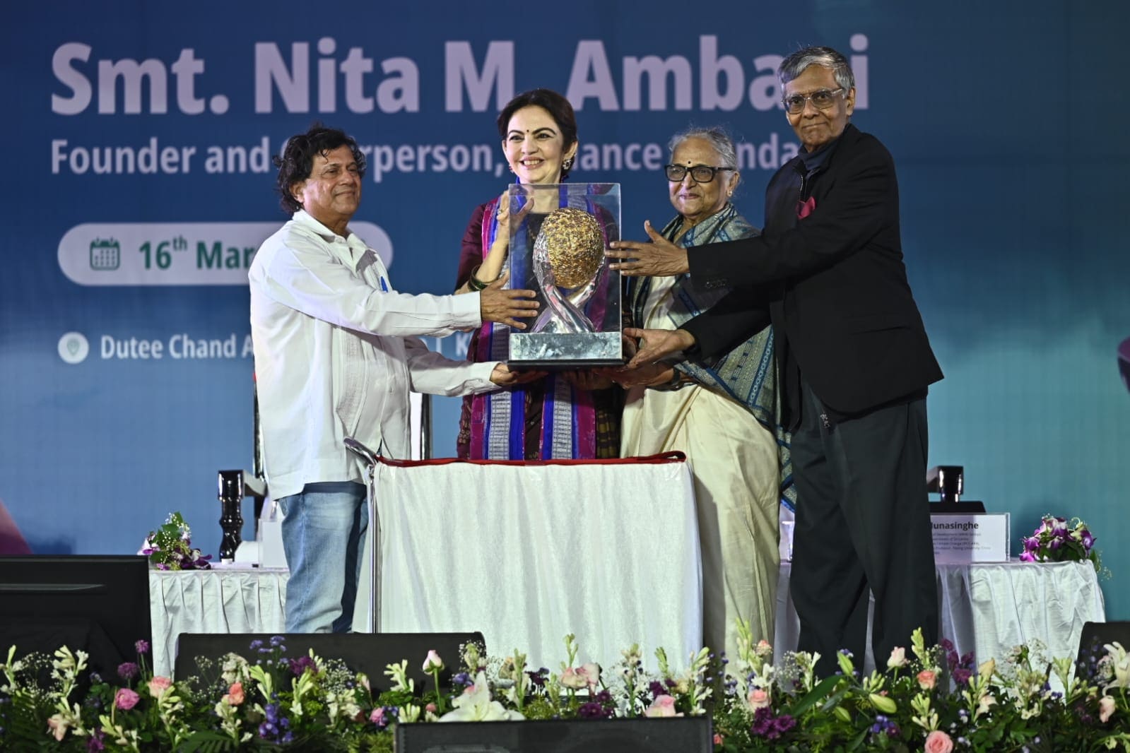 The award was presented by Nobel Laureate Prof. Mohan Munasinghe. Nita Ambani emphasised the importance of dreaming big and working hard during her acceptance speech at KISS. (KISS) The award was presented by Nobel Laureate Prof. Mohan Munasinghe. Nita Ambani emphasised the importance of dreaming big and working hard during her acceptance speech at KISS. (KISS)