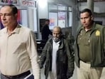 Kamruddin, alias Baba, arrested by Delhi Police in connection with the bodies of three people found in a car on the Peeragarhi flyover. Kamruddin, alias Baba, arrested by Delhi Police in connection with the bodies of three people found in a car on the Peeragarhi flyover.