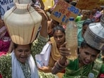 Aarey residents hit the streets on Friday to protest over the delayed NOCs for piped water. (Satish Bate/Hindustan Times)