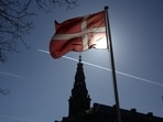 A Danish flag flies in front of Christiansborg Palace, which houses Denmark's parliament, in Copenhagen, Denmark, March 18, 2026. 