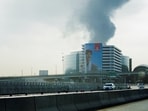 Smoke rising from an area near the Dubai International Airport is seen through the windshield of a vehicle, after a drone attack in Dubai, United Arab Emirates.