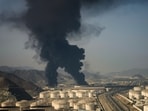 Plumes of smoke rise from an oil facility in Fujairah, United Arab Emirates, Saturday, March 14, 2026.