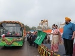 Rekha Gupta flags off newly inducted electric buses at Indraprastha Bus Depot in New Delhi.
