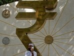 File: An installation of the Rupee logo and Indian currency coins outside the Reserve Bank of India (RBI) headquarters in Mumbai
