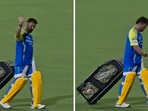 MS Dhoni walks off the field with a slight limp. MS Dhoni walks off the field with a slight limp.