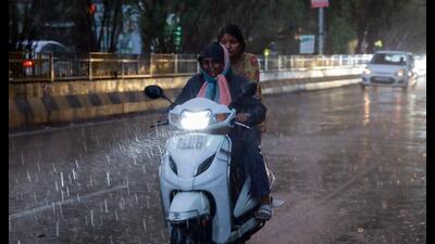 Commuters on their way amid rain, in Jalandhar on Friday. (HT Photo) Commuters on their way amid rain, in Jalandhar on Friday. (HT Photo)