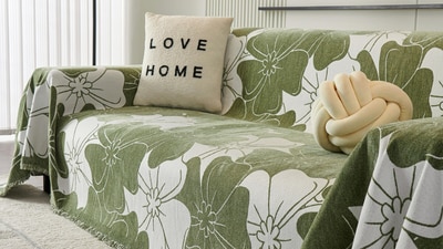 A living room styled with floral sofa covers and bright cushions that instantly bring a breezy summer mood into the home. (Pexels.com) A living room styled with floral sofa covers and bright cushions that instantly bring a breezy summer mood into the home. (Pexels.com)