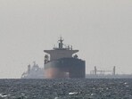 FILE PHOTO: Cargo ships in the Gulf, near the Strait of Hormuz, as seen from northern Ras al-Khaimah, near the border with Oman’s Musandam governance, amid the U.S.-Israeli conflict with Iran, in United Arab Emirates, March 11, 2026. REUTERS/Stringer/File Photo/File Photo (REUTERS)