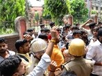 Students and police personnel at the Udai Pratap College in Varanasi on Friday. (HT Photo)