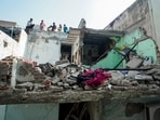 Victims include a couple hit by falling debris; police arrest owner, caretaker as probe flags poor building condition. (PTI)