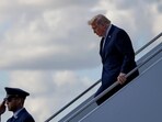 President Donald Trump steps off Air Force One, Friday, March 20, at Palm Beach International Airport 