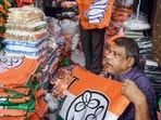 Vendors sell election campaign materials ahead of the West Bengal legislative assembly elections, in Kolkata 