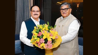 Chandigarh administrator Gulab Chand Kataria with Union health minister Jagat Prakash Nadda in Delhi. (HT)