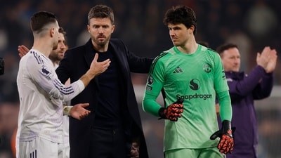 Manchester United interim manager Michael Carrick with Diogo Dalot and Lammens after the match. (Action Images via Reuters)